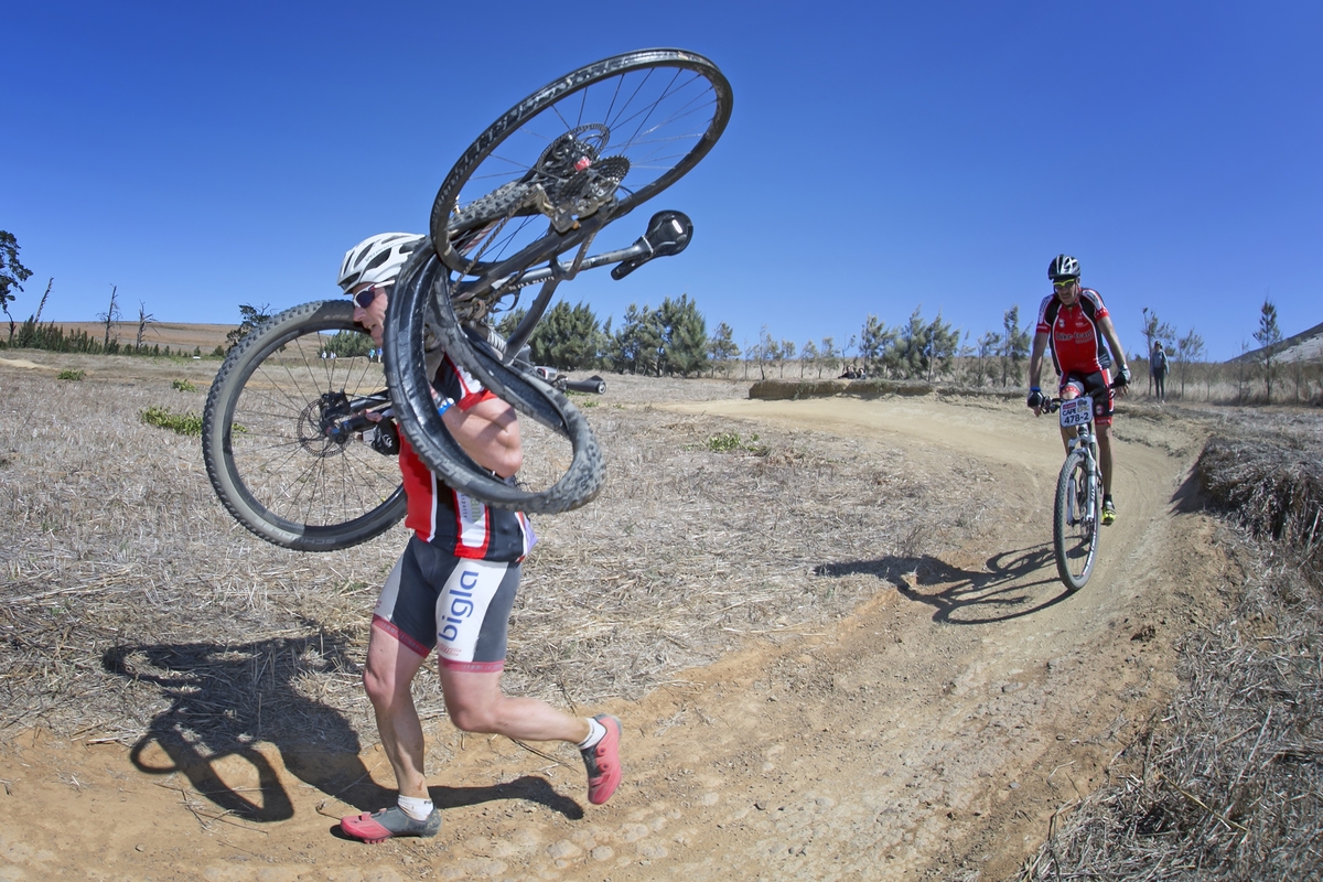 Werner Brunner of Switzerland having to carry his bike to the finish of the Prologue of the 2016 Absa Cape Epic Mountain Bike stage race held at Meerendal Wine Estate in Durbanville, South Africa on the 13th March 2016 Photo by Mark Sampson/Cape Epic/SPORTZPICS PLEASE ENSURE THE APPROPRIATE CREDIT IS GIVEN TO THE PHOTOGRAPHER AND SPORTZPICS ALONG WITH THE ABSA CAPE EPIC ace2016