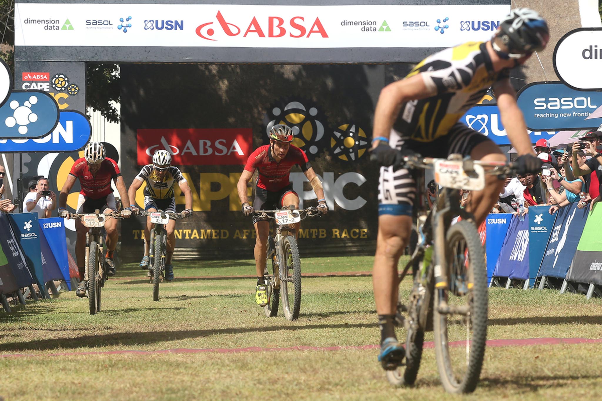 Urs Huber of the Bulls looks back to his partner as Nicola Rohrbach and Matthias Pfommer of Centurion Vaude by Meerendal 2 finish ahead of Karl Platt of the Bulls to win the stage during stage 5 of the 2016 Absa Cape Epic Mountain Bike stage race held from the Cape Peninsula University of Technology in Wellington to Boschendal in Stellenbosch, South Africa on the 18th March 2016 Photo by Shaun Roy/Cape Epic/SPORTZPICS PLEASE ENSURE THE APPROPRIATE CREDIT IS GIVEN TO THE PHOTOGRAPHER AND SPORTZPICS ALONG WITH THE ABSA CAPE EPIC {ace2016}