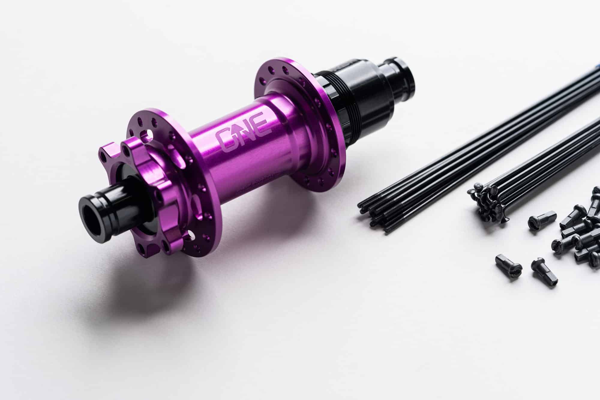 https://www.vojomag.com/app/uploads/2024/06/OneUp Components Rear Hub Wheelbuild SpecsPurple.jpg